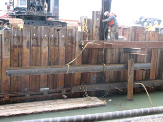 Gillen, a port tenat, is repairing a dockwall near the liquid cargo pier.