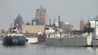 The Algowood is arriving with salt while the Lafarge vessel is unloading cement (Stewart Cort is in the background with the City skyline)