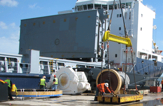 Members of the ILA work to secure heavy equipment before being loaded onto the Rosaire A. Desgagnes in June of 2009