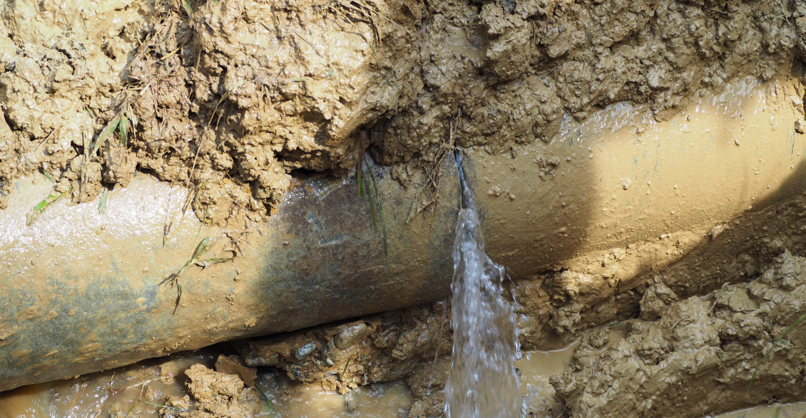 A 15-inch diameter AC pipe that is leaking or has burst.