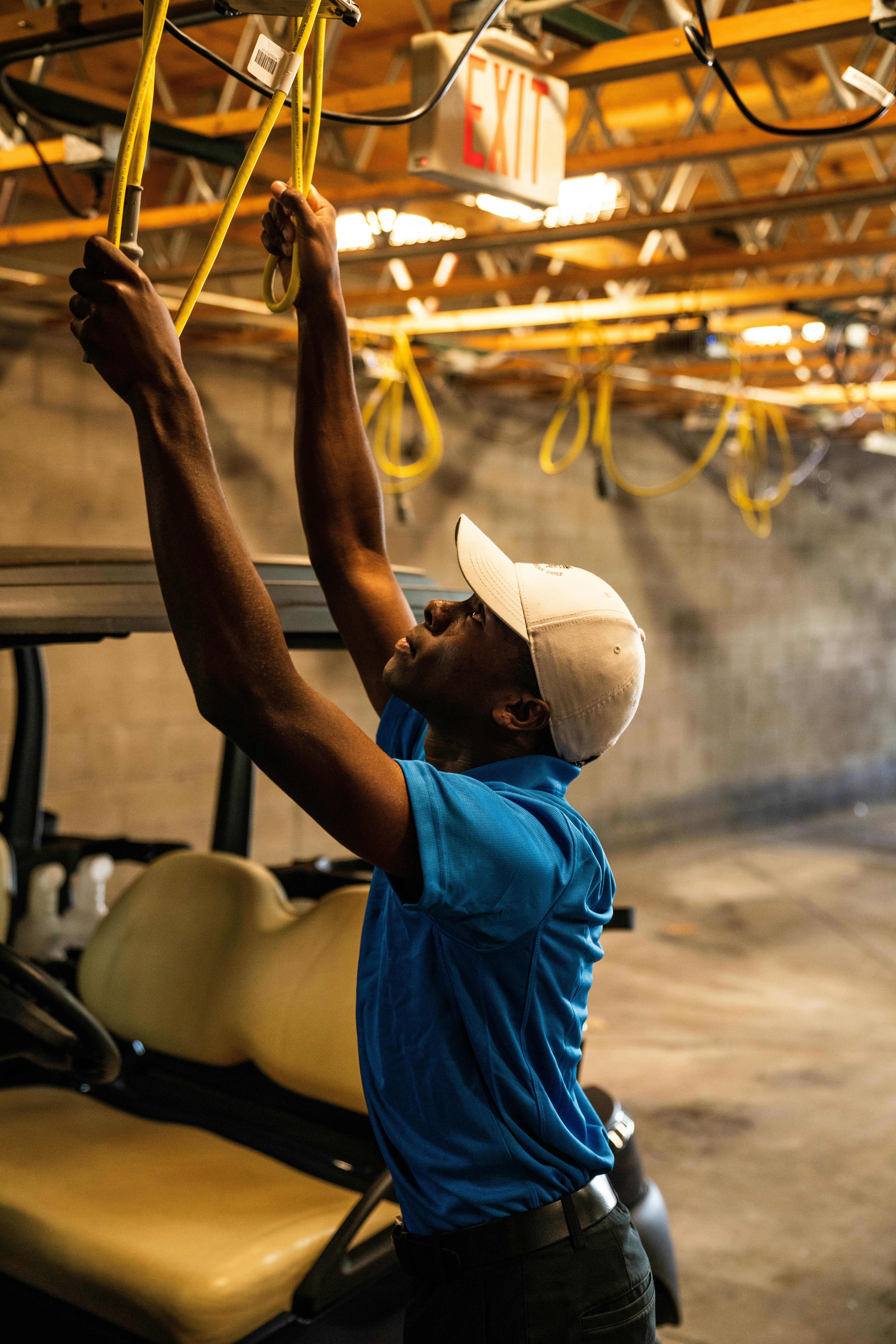 Person in hard hat working with wires