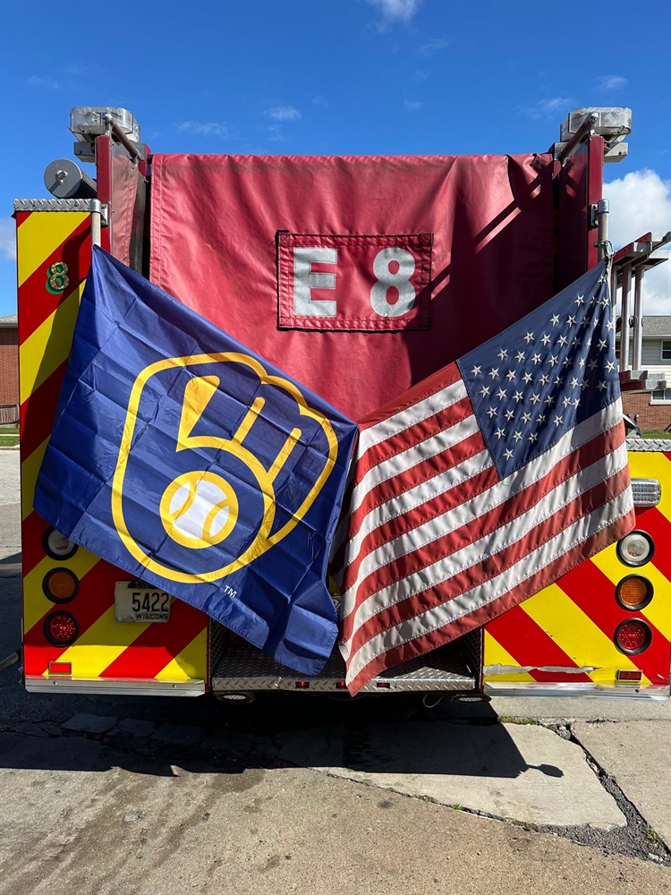 Rear of MFD Engine 8 with American flag and Milwaukee Brewers Flag