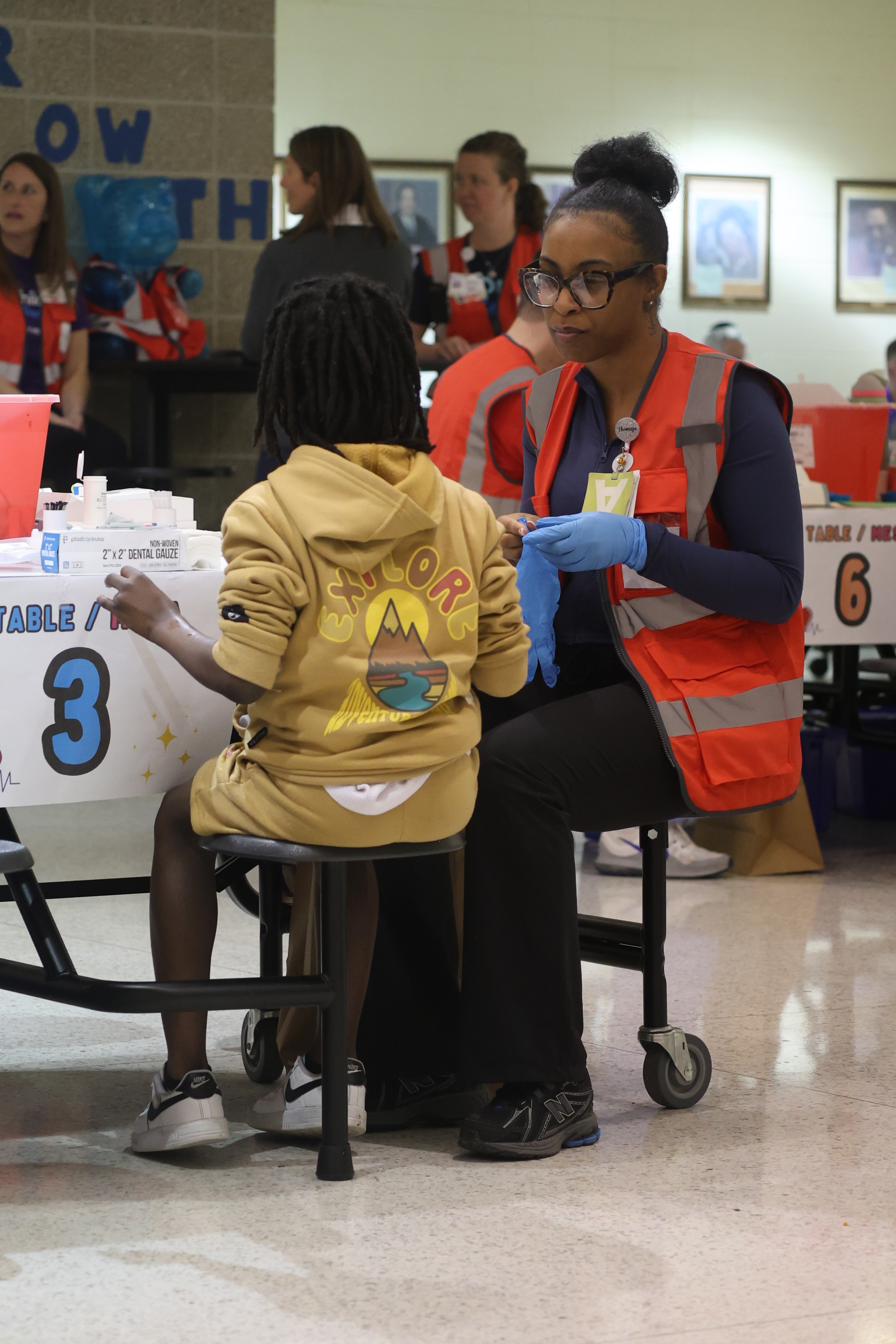 Health department nurse testing an MPS student's blood lead level