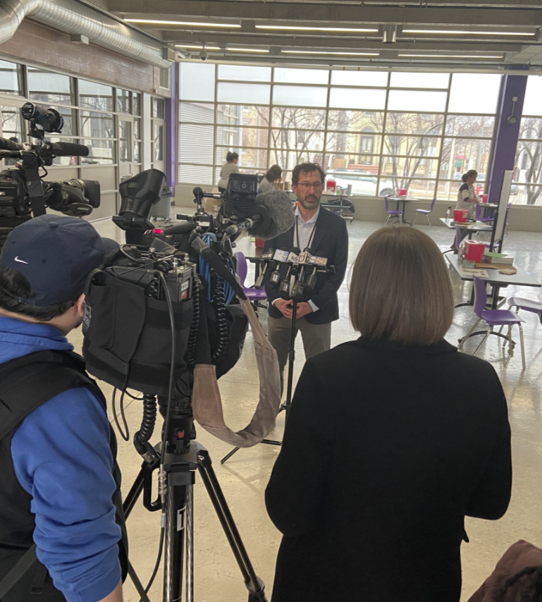 Deputy Commissioner Tyler Weber speaking with reporters