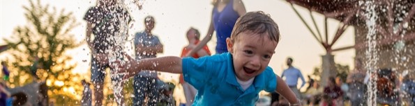 Child plays in splash pad