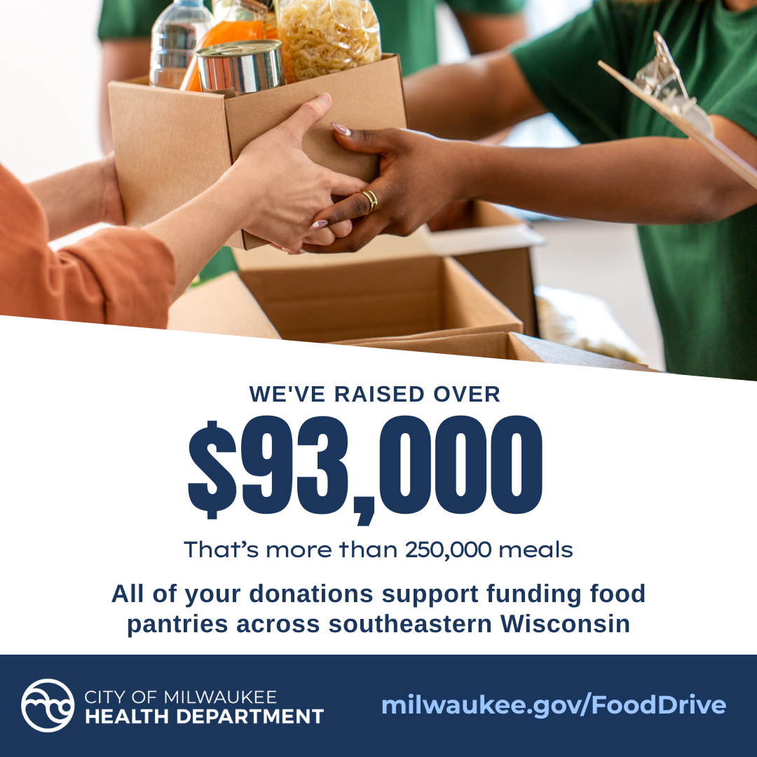 Hands passing a box full of food donations from one person to another