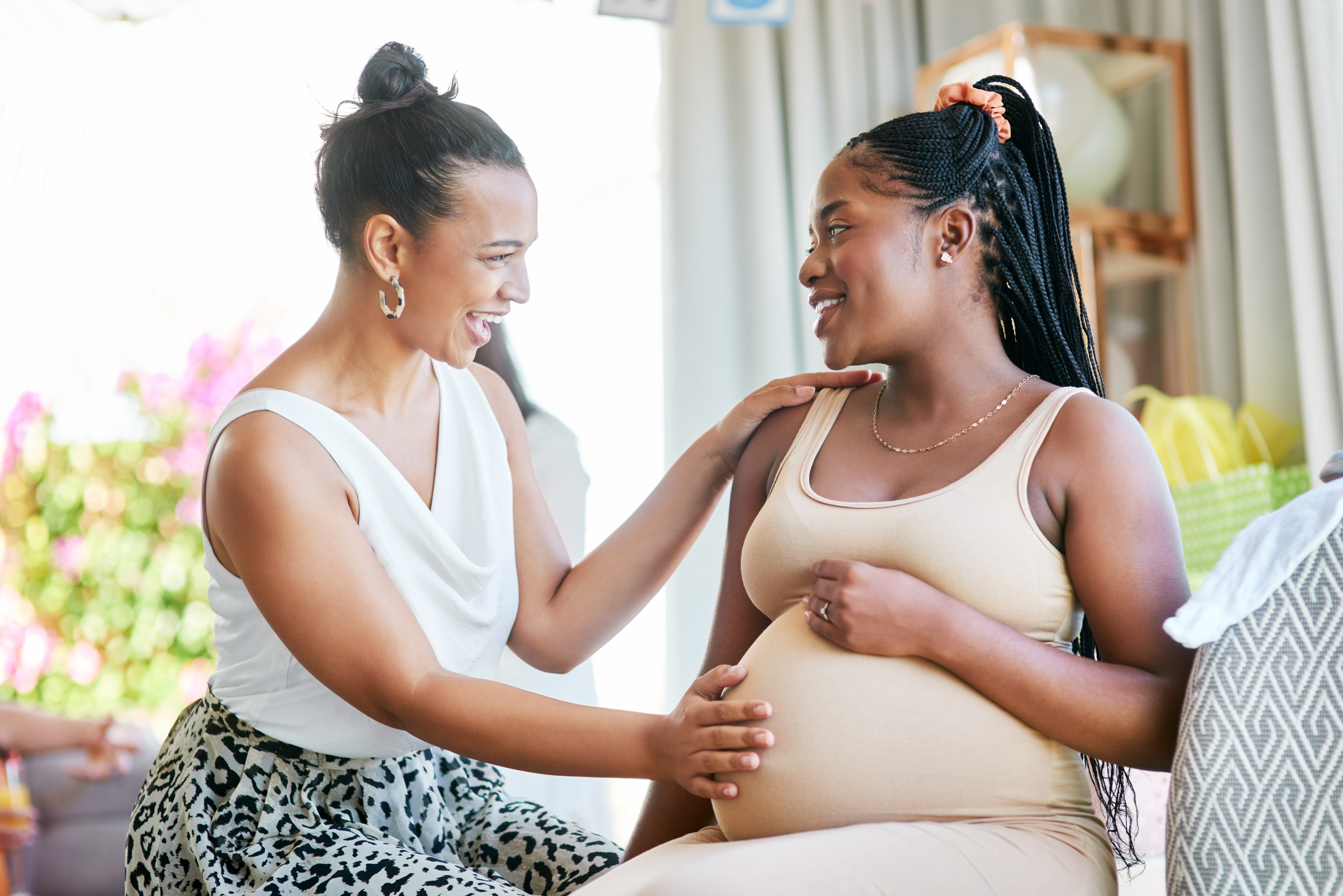 Pregnant person receives support from a friend