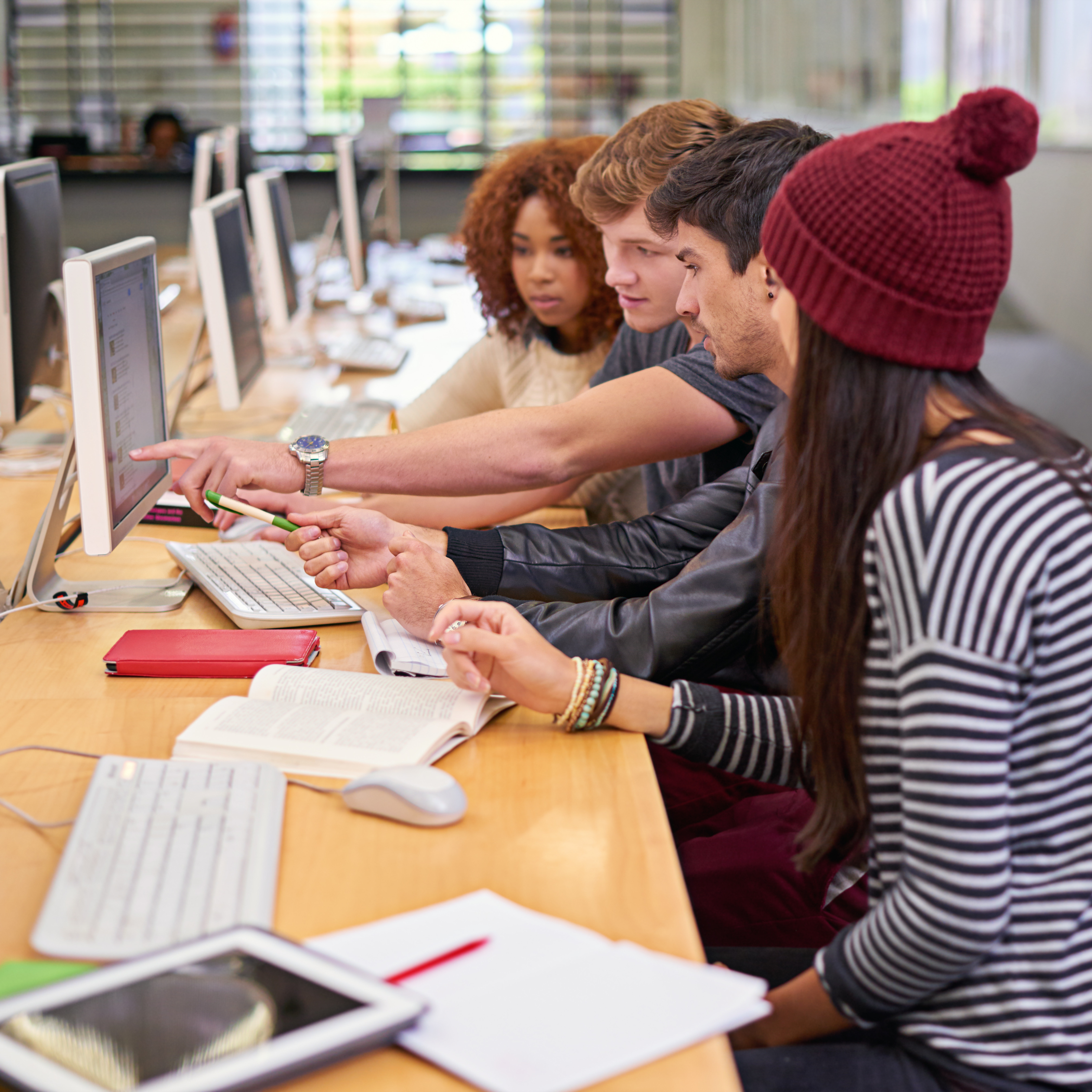 College students gathering at a research table